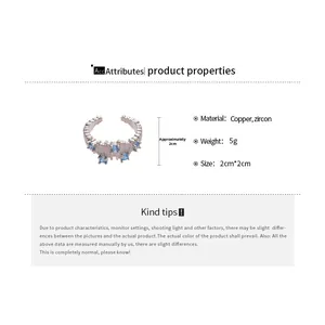 Irregular copper ring with sea-blue zircon inlay and silver-tone finish details