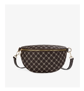 Close-up of a crescent-shaped waist bag featuring brown logo print and gold hardware