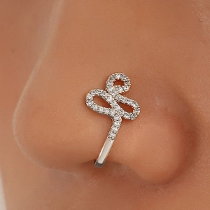Detailed view of U-shaped non-piercing copper nose clip with sparkling zircon stones