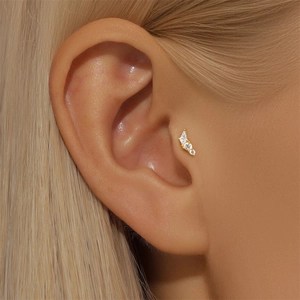 Detail showing marquise opal and zircon stud on ear with gold threaded ball post