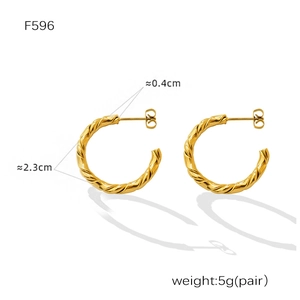Detail view of gold-plated twisted C-shaped earrings with F596 dimensions and weight