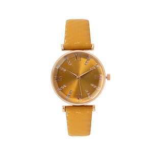 Detailed view of ginger leather watch strap with rose gold case and diamond bow dial