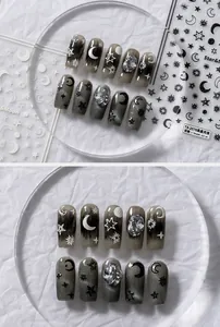 Detail of embossed Starry Night nail art stickers with 3D stars, moons and rhinestones