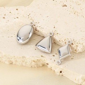 Minimalist silver geometric stainless steel pendants in oval, triangle, and rhombus shapes