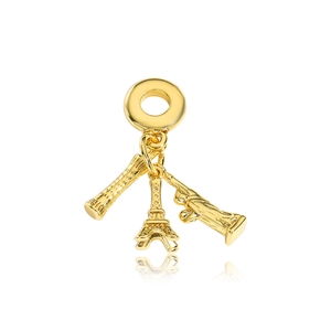 Detailed view of gold charms featuring a lipstick, Eiffel Tower, and high-heel shoe