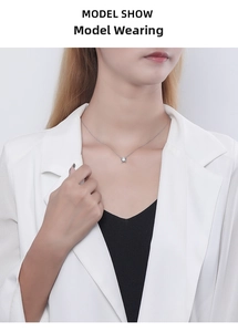 Close-up of minimalist S925 silver necklace with square cubic zirconia pendant on model