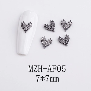 Detailed view of 7x7mm vintage gunmetal 3D heart-shaped nail art charm with cross texture