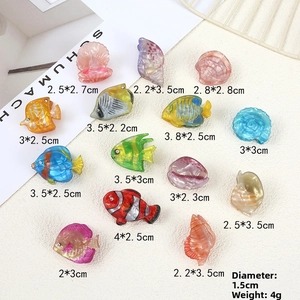 Detailed flat lay of ocean-themed resin hair clips with shell and tropical fish shapes