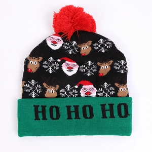 Christmas LED beanie with Santa reindeer patterns and Ho Ho Ho text in black green and red