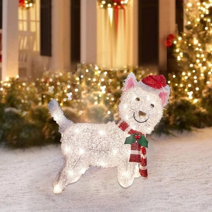 Luminous Christmas puppy garden stake with red hat and scarf in a snowy outdoor scene