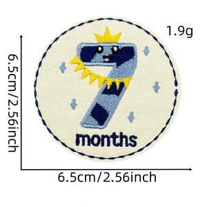 Embroidered 7 months baby milestone patch in blue and yellow with crown detail