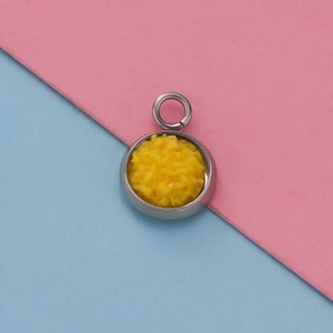 Detail of 12mm stainless steel round pendant tray with yellow glitter resin filling