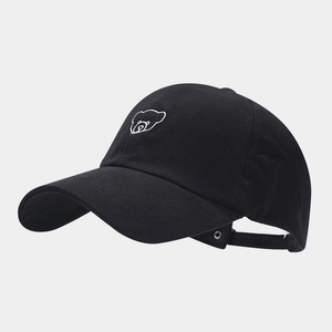 Detail of bear embroidery and adjustable metal buckle on black cotton baseball cap