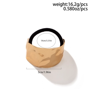 Detail of gold metal hair tie with hammered texture and dimensions for ponytail hair accessories