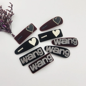 Detailed close-up of velvet hair ties with rhinestone hearts and Chance lettering