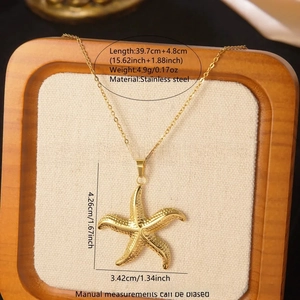 Detailed macro view of starfish pendant necklace in polished stainless steel