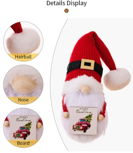Detail view of a Christmas gnome doll featuring a knit hat and Merry Christmas wooden sign