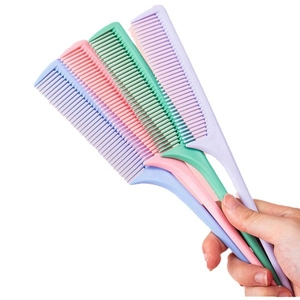 Set of four colorful plastic tail combs for hair styling in blue, pink, green, and purple