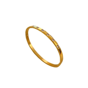 Elegant gold titanium steel bracelet with sparkling round crystals in a minimalist design