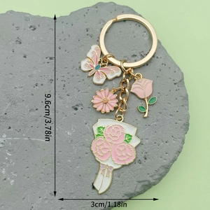 Golden crown fan keychain with pink enamel butterfly, daisy and rose charms 9.6cm