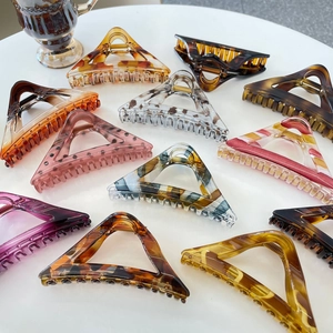 Chic triangular tortoiseshell hair claws in assorted gradient acetate patterns