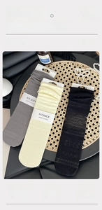 Detailed macro view of breathable honeycomb knit cotton socks in three colors