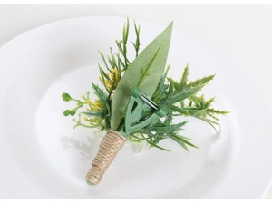 Close-up of artificial forest boutonniere with green leaves and rustic hemp rope handle