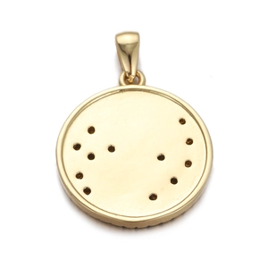 Close-up of golden round compass pendant with star and moon motif and zircon inlay