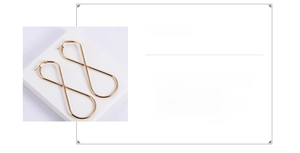 Detail of gold 316L stainless steel infinity earrings showing the 29x80mm size specs
