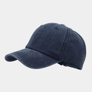 Navy blue washed cotton ponytail baseball cap with a vintage distressed finish for women