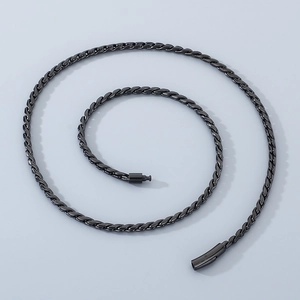 Macro detail of black twisted woven chain necklace with secure clasp closure
