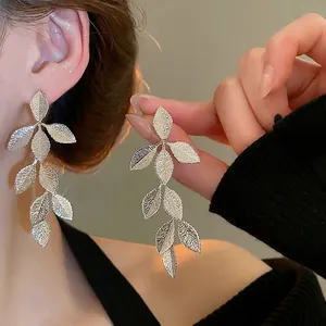 Silver leaf tassel drop earrings with detailed vein texture for women's elegant style