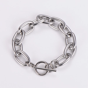 Close-up of a silver chunky cable chain bracelet featuring a classic OT toggle clasp design