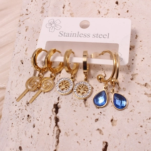 Three-pair gold stainless steel earrings set featuring tree of life and blue teardrop gems