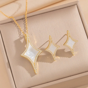 Golden star jewelry set with white mother of pearl and diamonds in a gift box