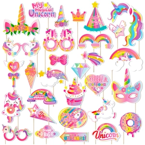 Unicorn themed party photo booth props with masks and glasses for kids birthday party