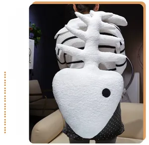 Detail of creative fishbone-shaped plush backpack made of soft white faux rabbit fur