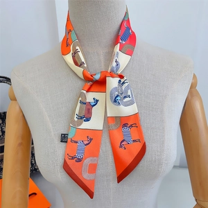Detailed view of luxury horse print twilly silk scarf tied on a female mannequin neck