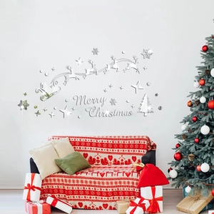 Silver mirror acrylic Christmas wall stickers featuring Santa, reindeer and stars on a wall