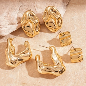 Modern gold irregular lava earrings set including pebble studs and wavy hoop jewelry