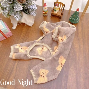 Winter pet onesie with bear print on double-sided warm fleece in festive holiday setting