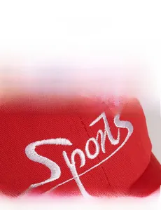 Close-up of red cotton baseball cap featuring white 3D letter embroidery and fine texture