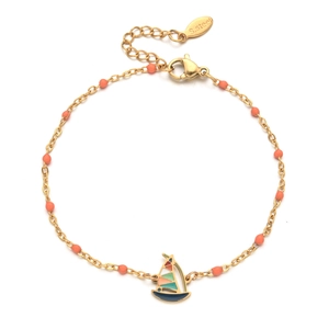 Macro detail of stainless steel bracelet with orange beads and enamel sailboat charm