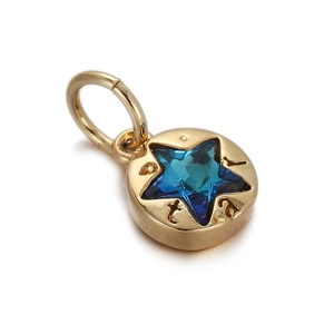 Detailed view of a gold-plated round pendant with a blue star-shaped gemstone center