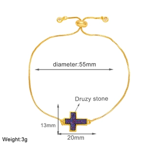 Detail of adjustable gold box chain bracelet with purple druzy stone cross pendant