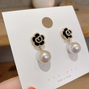 Elegant black camellia flower earrings with rhinestones and large round iridescent pearls