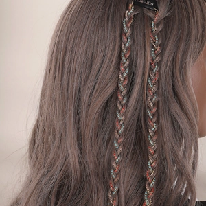 Braided hair chain extension with colorful rhinestones on long hair for stylish hairstyles
