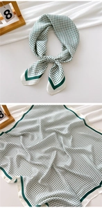 Detail of green and white checkered silk square scarf with deep green wide borders