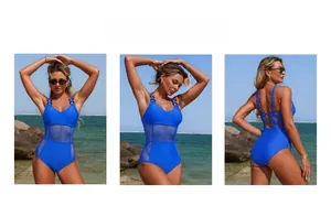 Blue one-piece swimsuit with mesh cut-outs and metal ring details in beach setting