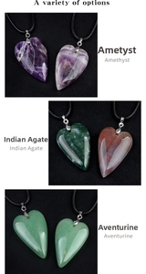 Detailed view of heart shaped amethyst, Indian agate and aventurine crystal pendants
